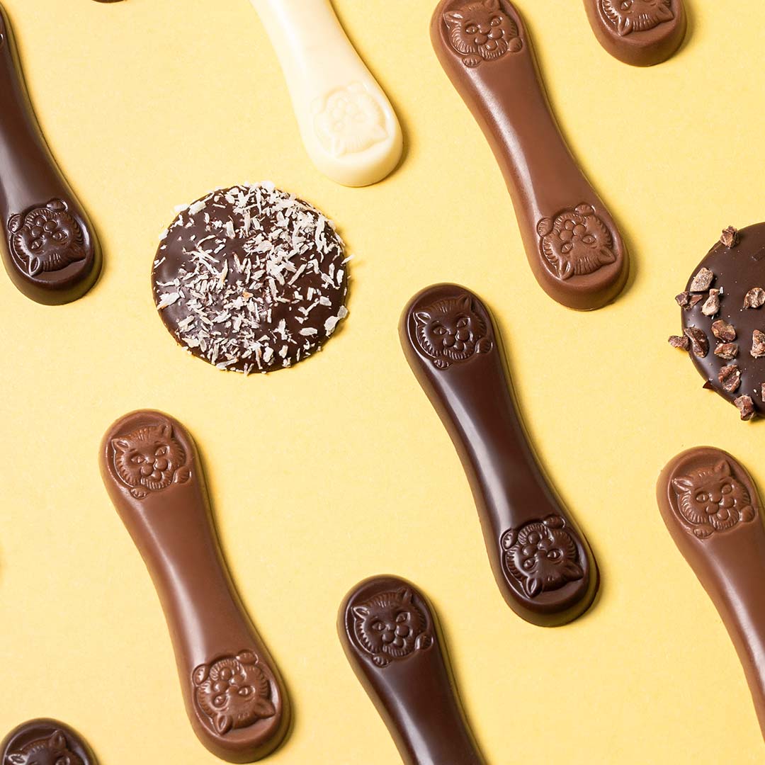 Lenguas de gato leche bandeja 130g en formato a granel.