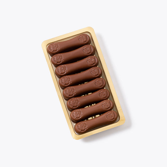 Lenguas de gato leche bandeja 130g en formato a granel.